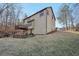 A view of the house and backyard that includes a wooden deck at 2782 Blue Moon Dr, Buford, GA 30519