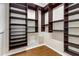 Walk-in closet with custom shelving and wooden floors at 2949 Gateland Sq, Marietta, GA 30062