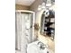 Small bathroom with a shower, sink, and mirror at 3112 Laura Ln, Lithia Springs, GA 30122