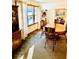 Traditional dining room with wooden furniture and a stained glass window at 3112 Laura Ln, Lithia Springs, GA 30122