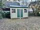 Outdoor shed with double doors and multiple windows for storage at 3112 Laura Ln, Lithia Springs, GA 30122