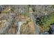 An aerial view of the property showing the house, driveway, and surrounding trees and neighborhood at 3461 Valley View Dr, Marietta, GA 30068