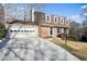 Exterior view of the home featuring a two-car garage and well-maintained landscaping at 3461 Valley View Dr, Marietta, GA 30068