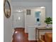 Bright foyer featuring hardwood floors, a white front door, and sightlines into a nearby bathroom at 3461 Valley View Dr, Marietta, GA 30068