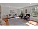 Cozy living room featuring hardwood floors, area rug, neutral paint, with natural light coming through the windows at 3461 Valley View Dr, Marietta, GA 30068