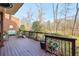 Inviting outdoor deck features comfortable seating and views of the backyard and tranquil lake, perfect for relaxation at 3994 Columns Dr, Marietta, GA 30067