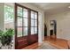 Bright foyer featuring hardwood floors and elegant glass double doors at 3994 Columns Dr, Marietta, GA 30067