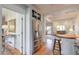 Open kitchen area with stainless steel refrigerator and view into the living space at 3994 Columns Dr, Marietta, GA 30067