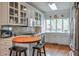 Well-lit kitchen features custom white cabinetry and stainless-steel appliances at 3994 Columns Dr, Marietta, GA 30067