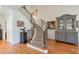 Inviting staircase with decorative iron spindles and hardwood treads at 3994 Columns Dr, Marietta, GA 30067