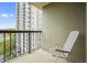 Cozy balcony with a chair, offering a relaxed outdoor space with views of the building's exterior at 795 Hammond Dr # 709, Atlanta, GA 30328