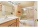 Bathroom featuring a single sink vanity and shower-tub combo at 795 Hammond Dr # 709, Atlanta, GA 30328