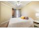 Cozy bedroom with a large bed, ceiling fan, and soft neutral colors at 795 Hammond Dr # 709, Atlanta, GA 30328