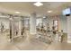 Spacious gym featuring various exercise equipment, including treadmills and weight machines, for residents' fitness needs at 795 Hammond Dr # 709, Atlanta, GA 30328