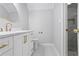 Modern bathroom featuring stylish fixtures, shower, and a white stone vanity at 8900 River Trace Dr, Johns Creek, GA 30097