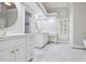 Bright bathroom with marble floors, double sinks, vanity, and lots of storage at 8900 River Trace Dr, Johns Creek, GA 30097