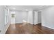 Expansive bedroom featuring hardwood floors, an adjacent bathroom, and ample natural light at 8900 River Trace Dr, Johns Creek, GA 30097