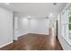 A home bedroom featuring hardwood floors and natural light at 8900 River Trace Dr, Johns Creek, GA 30097