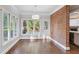 Cozy breakfast nook with bright windows and a brick accent wall at 8900 River Trace Dr, Johns Creek, GA 30097