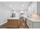 Modern kitchen with stainless steel appliances, granite countertops, and a spacious island at 8900 River Trace Dr, Johns Creek, GA 30097