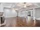 Bright living room showcasing coffered ceilings, a brick fireplace, and hardwood floors at 8900 River Trace Dr, Johns Creek, GA 30097