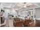 Spacious living room with coffered ceilings, brick fireplace, and comfortable seating arrangement at 8900 River Trace Dr, Johns Creek, GA 30097