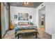 Bright bedroom with concrete ceilings and large windows allowing for natural light at 44 Peachtree Ne Pl # 1225, Atlanta, GA 30309