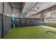 A convenient pet-friendly dog run with artificial turf and waste disposal stations for residents at 44 Peachtree Ne Pl # 1225, Atlanta, GA 30309