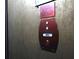 Elevator buttons with Braille for accessibility, featuring a sign that reads, 'In fire, do not use elevator' at 44 Peachtree Ne Pl # 1225, Atlanta, GA 30309