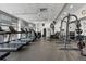 Modern fitness center featuring treadmills and weight machines with ample workout space at 44 Peachtree Ne Pl # 1225, Atlanta, GA 30309