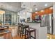 Modern kitchen with stainless steel appliances and breakfast bar seating overlooking the hardwood floor living area at 44 Peachtree Ne Pl # 1225, Atlanta, GA 30309