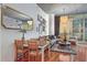 Spacious living and dining area featuring hardwood floors, comfortable seating, and plenty of natural light at 44 Peachtree Ne Pl # 1225, Atlanta, GA 30309