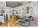 Open-concept living space boasting hardwood floors, modern furnishings, and ample natural light at 44 Peachtree Ne Pl # 1225, Atlanta, GA 30309
