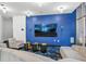 Modern resident lounge featuring a large screen TV, stylish seating, and contemporary lighting at 44 Peachtree Ne Pl # 1225, Atlanta, GA 30309