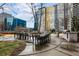 Outdoor dining area with large table, grill, and modern architecture, perfect for gatherings at 44 Peachtree Ne Pl # 1225, Atlanta, GA 30309