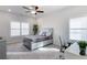 Bedroom with neutral walls, carpet, and a comfortable bed and workspace at 1512 Harvest Park Ln, Suwanee, GA 30024