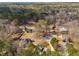 An aerial view of the neighborhood with houses surrounded by lush trees at 21 Heather Ln, Villa Rica, GA 30180