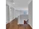 Upstairs hallway with hardwood floors and natural light at 420 Glenridge Close Ct, Atlanta, GA 30328