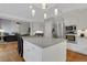 Open kitchen with stainless steel appliances, white cabinets, and stone countertops at 420 Glenridge Close Ct, Atlanta, GA 30328