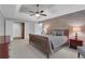 Spacious main bedroom featuring brick accent wall, trey ceiling, and walk-in closet at 420 Glenridge Close Ct, Atlanta, GA 30328