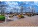 Inviting outdoor seating area with modern benches and tables on a brick-paved ground at 420 Glenridge Close Ct, Atlanta, GA 30328