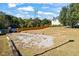 Large, flat backyard with gravel pad, wooden privacy fence and mature trees at 2316 Watson Fain Trl, Loganville, GA 30052