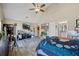 Bright bedroom featuring vaulted ceiling, fan, wood-look floors and access to ensuite bathroom at 2316 Watson Fain Trl, Loganville, GA 30052