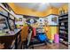 Personal Cave provides treadmill, games, Steelers decor, and lots of shelving at 2316 Watson Fain Trl, Loganville, GA 30052