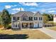Beautiful two-story home with a well-manicured lawn and an attached two-car garage at 2316 Watson Fain Trl, Loganville, GA 30052