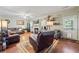 Inviting living room with hardwood floors, fireplace, and lots of natural light at 2316 Watson Fain Trl, Loganville, GA 30052