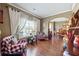 Cozy living room with comfortable seating, hardwood floors, and plenty of natural light at 2316 Watson Fain Trl, Loganville, GA 30052