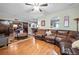 Spacious living room with hardwood floors and sliding barn doors at 2316 Watson Fain Trl, Loganville, GA 30052