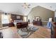 Spacious main bedroom featuring hardwood floors, vaulted ceilings, and ample natural light at 2316 Watson Fain Trl, Loganville, GA 30052
