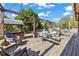Spacious wooden deck featuring an outdoor dining area and a separate shaded lounge area, perfect for entertaining at 2316 Watson Fain Trl, Loganville, GA 30052